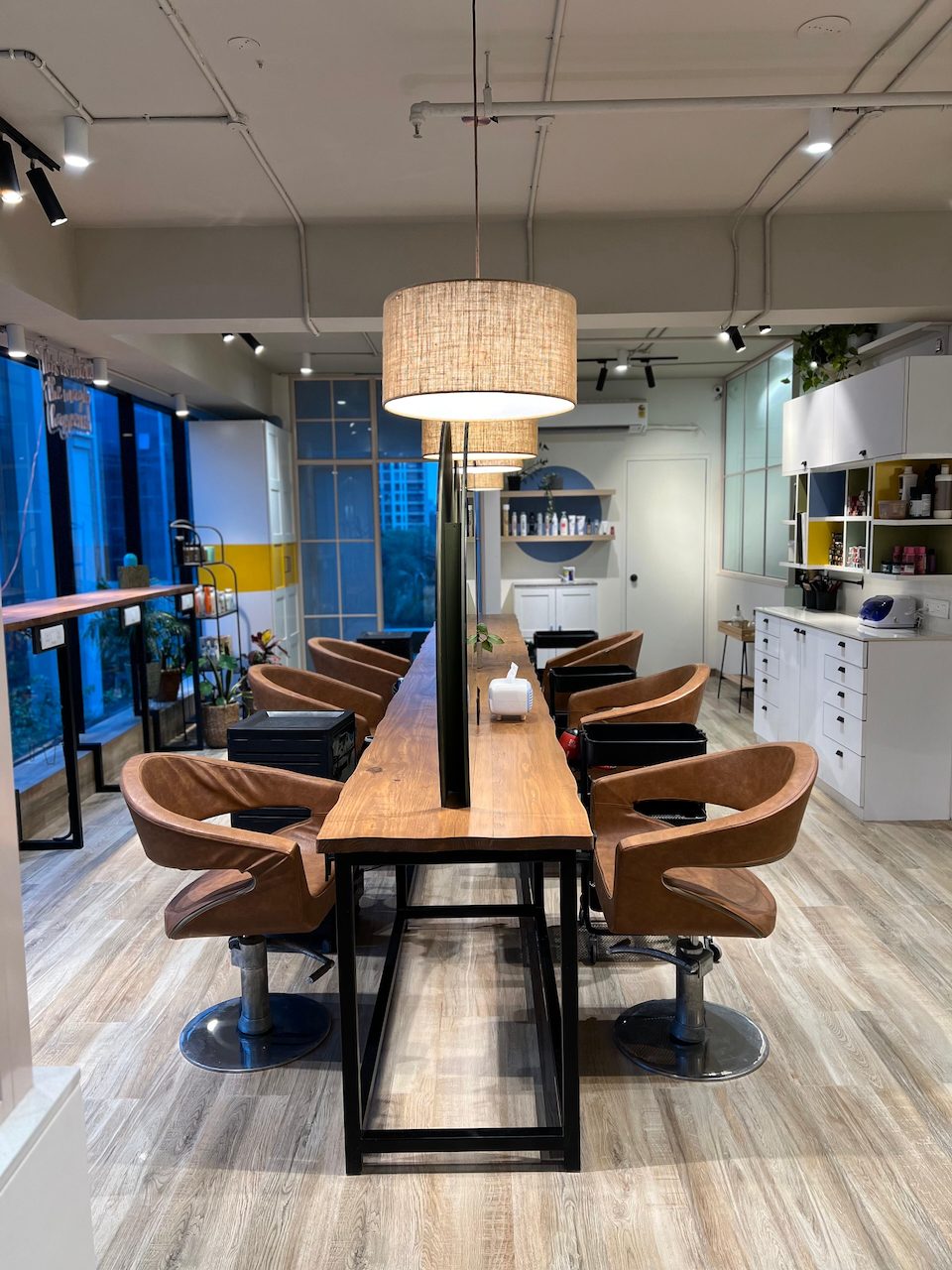 Styling stations down a long live-edge walnut counter